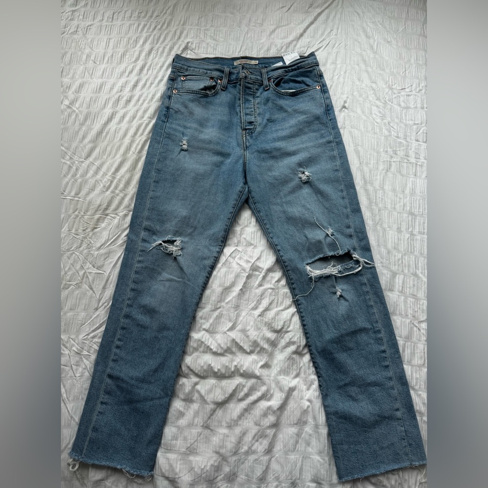 Ripped Levi’s Blue Jeans